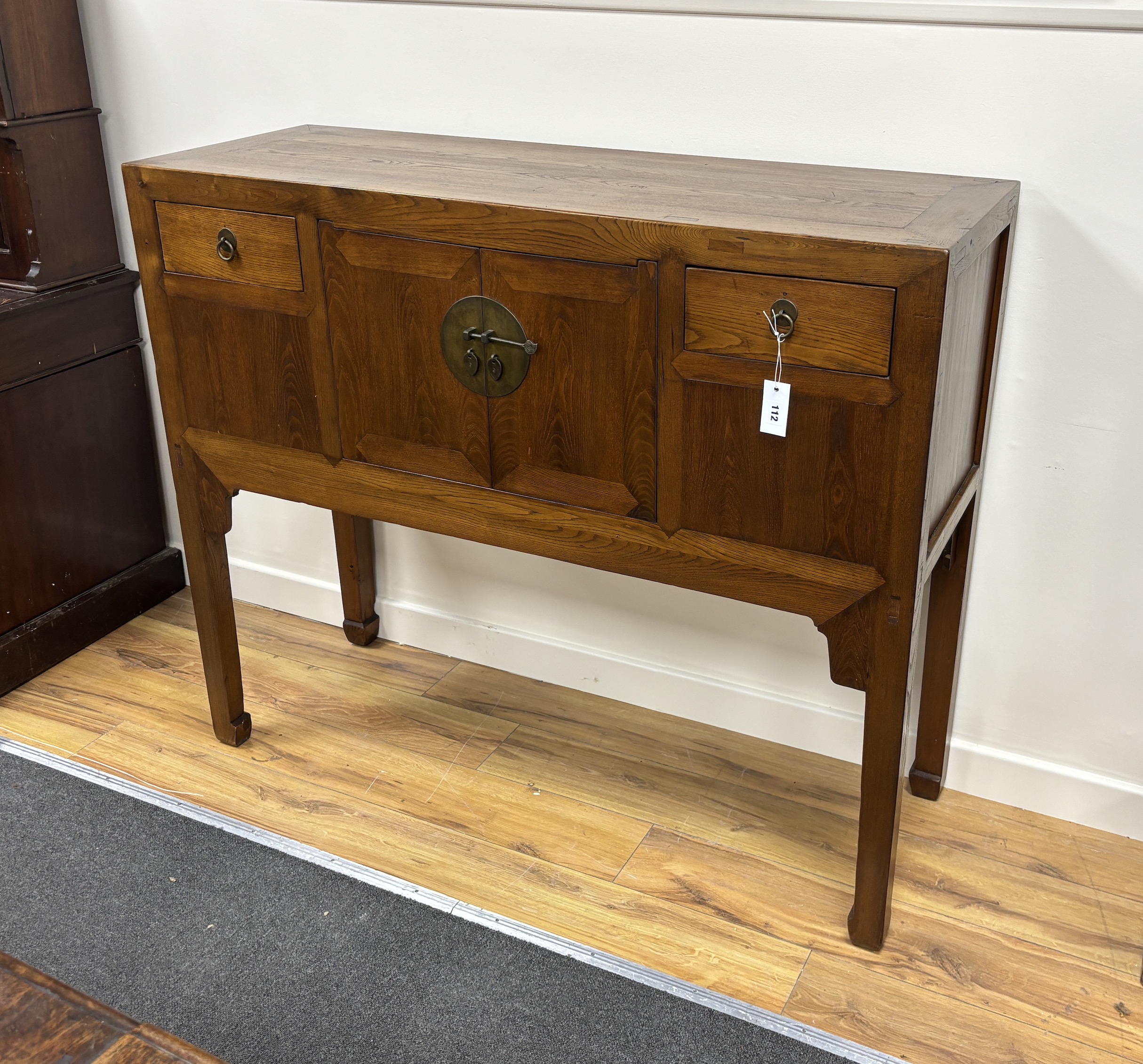 A Chinese elm jumu cabinet, width 128cm, depth 44cm, height 107cm